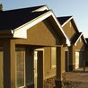 Row of townhome entries with covered porches
