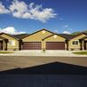 Row of townhomes with two-car garages and mountain views