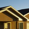 Townhome exterior with gabled rooflines and stucco finish